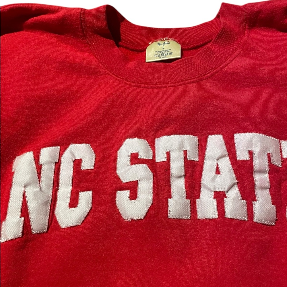 The game NC State Red Crewneck Sweatshirt for men - White Lettering size large
